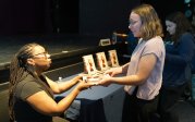 Princess Joy L. Perry, master lecturer at Old Dominion University and author of “This Here is Love,” signs a copy of her book and interacts with fans.
