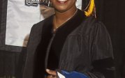 Dr. Linnie Carter poses in her regalia on commencement day.
