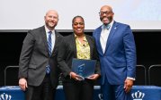 President Brian O. Hemphill and Executive Vice President Chad Reed with Monarch Values Award winner Gloria Boone at the Monarch Milestones Celebration on April 10, 2025.