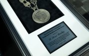 A photo of ODU's Presidential Medallion for Public Service.