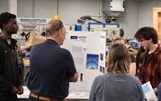 ATMOS team presenting their research.