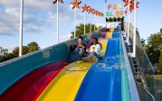 ODU students going down a slide.