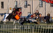 Students riding the cyclone swing.