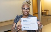 Ebony Clark holding a cetificate