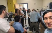 EnMed group taking notes in a chemical lab.
