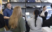 Enmed group of six taking part in a training session with lab equipment.
