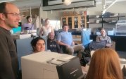 Enmed group of nine in a training session in the wet lab.