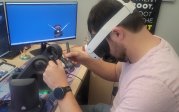 Student practicing dental work in a simulator.
