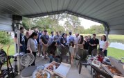 EnMed group taking a group photo at a social gathering.