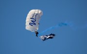 A parachuter lands in the ODU football stadium.