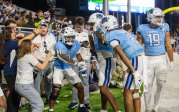 ODU football players celebrate after a touchdown.