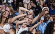 ODU students join hands to sing “Sweet Caroline” during Saturday’s game against North Carolina Central.