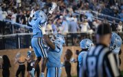 ODU offensive lineman Stephon Dubose-Pressley lifts TJ Lott Jr. in celebration after his late touchdown.