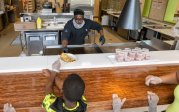 Chef serving food to a youth