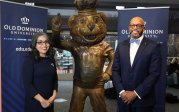 Dr. Marisela Rosas Hemphill and President Brian O. Hemphill, Ph.D. standing with Big Blue statue.