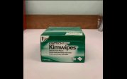 One green box of Kimwipes on a counter.