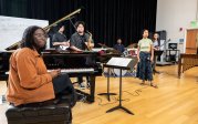 ODU students listen during the Lisanne Lyons clinic. Pictured, left to right, are Makenzie Joyner-Cassanova at the piano, Jack Moreno on bass, Kristian Quilon on saxophone, Michael Berry on drums, Kristiana Jones on vocals, and Mike Dean on guitar.