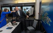 George McLeod, Ph.D., director of the Center for Geospatial Science, Education and Analytics (GeoSEA), demonstrates how AI is being used to map flooding during a Community Connection and Enablement Expo on Oct. 30.
