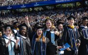A photo of students celebrating at graduation.