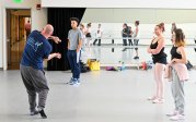 Teacher demonstrates dance move