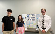 TFOS team – Emma, Bradley, Jacob, and Azyiah with their research poster.