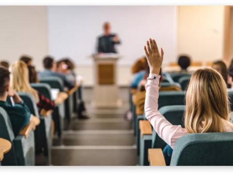 Student raising her hand in ODU class