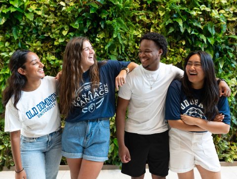 Four students laughing