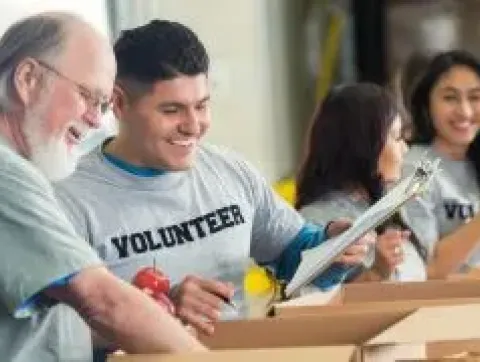 Volunteers working an assembly line