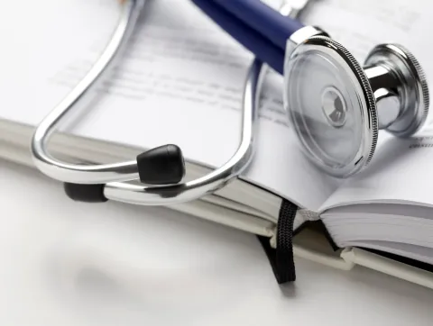 Stethoscope on book