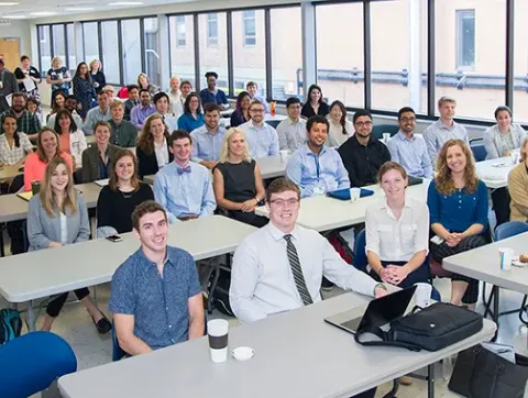Summer Scholars in classroom facing camera