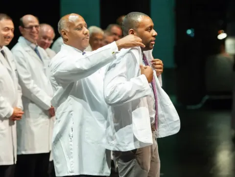 Derwin Gray is coated by his father