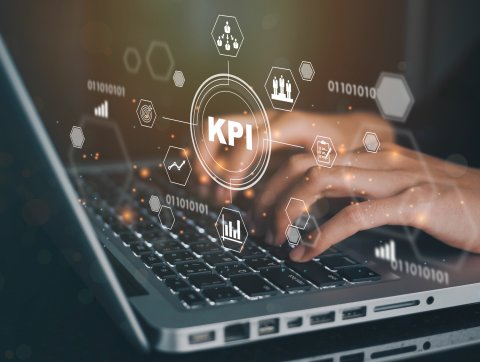 Businessman using a computer to view KPIs (key performance indicators)