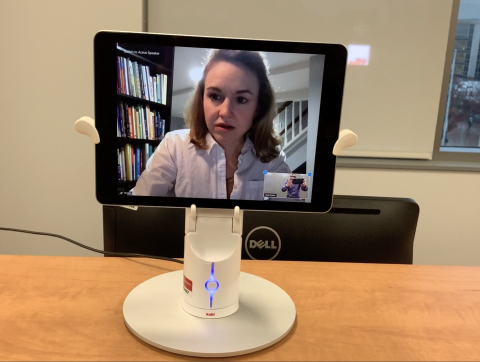 Virtual meeting takes place using table-top telepresence robot.