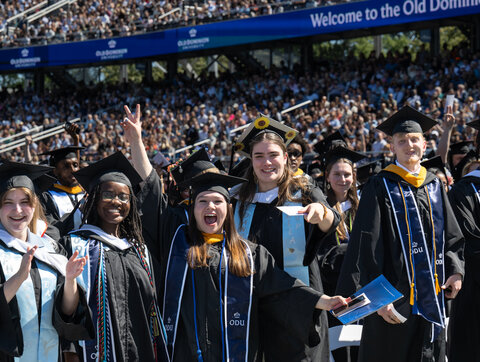 A photo of students celebrating at graduation.