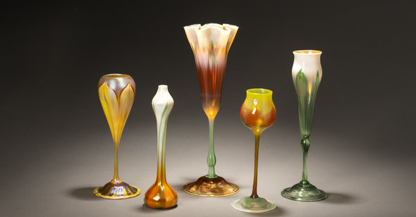 Glass artwork lined up in a row. 