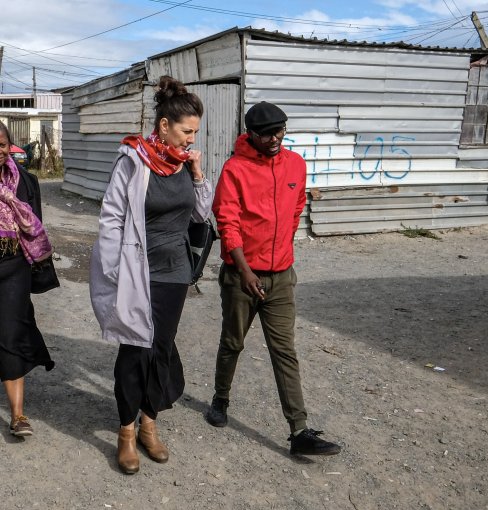 Melissa Miller-Felton,  Jennifer Fish, Ph.D., and  Khayalethu Kama walk the streets of Khayelitsha, South Africa.