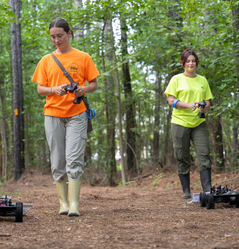 Two ODU students using tick bots.