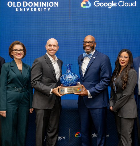President Brian O. Hemphill, Ph.D., presents a gift to Google representatives.