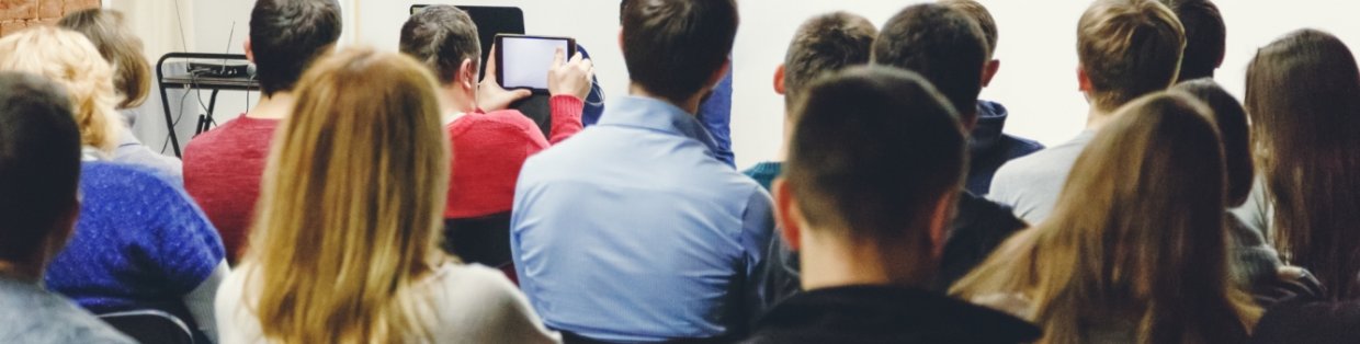 a group of students watching a lecture.