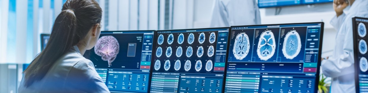 A doctor looking at x-rays of a brain.
