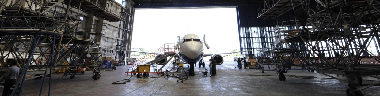 Hanger bay with an airplane inside.