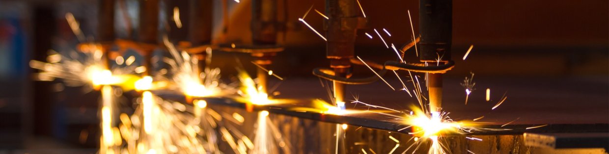 Sparks flying from a tool used to cut. 