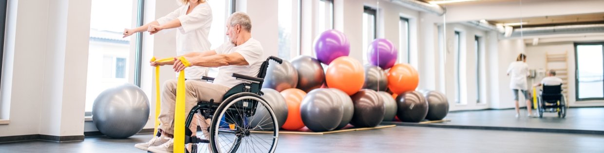 man in wheelchair doing yoga