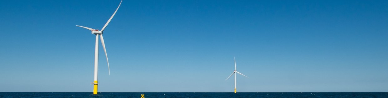 Wind turbine off in the distance. 