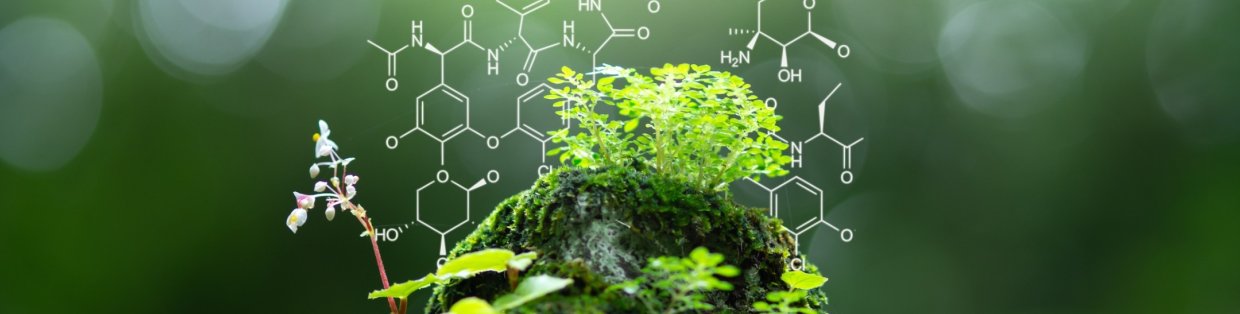 Atom chains of plant compounds on top a green background. 