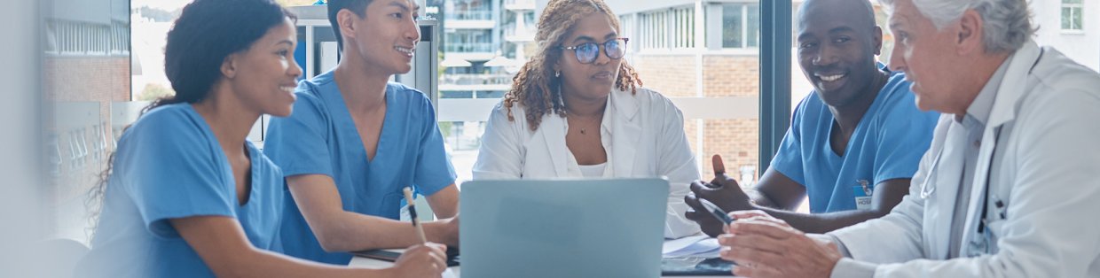 Doctors and administrators sitting around conference table