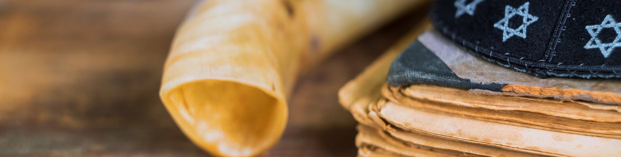 Shofar and paper documents on table