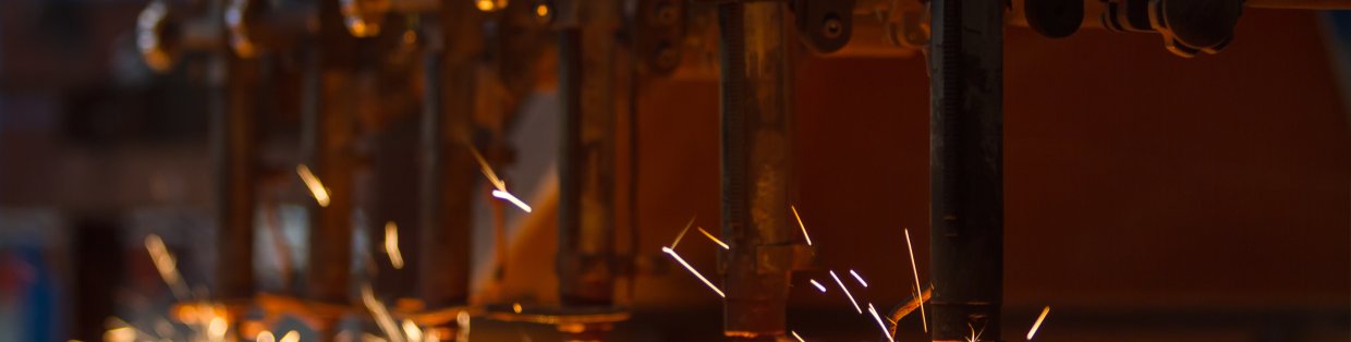 A mechanical tool throwing sparks. 
