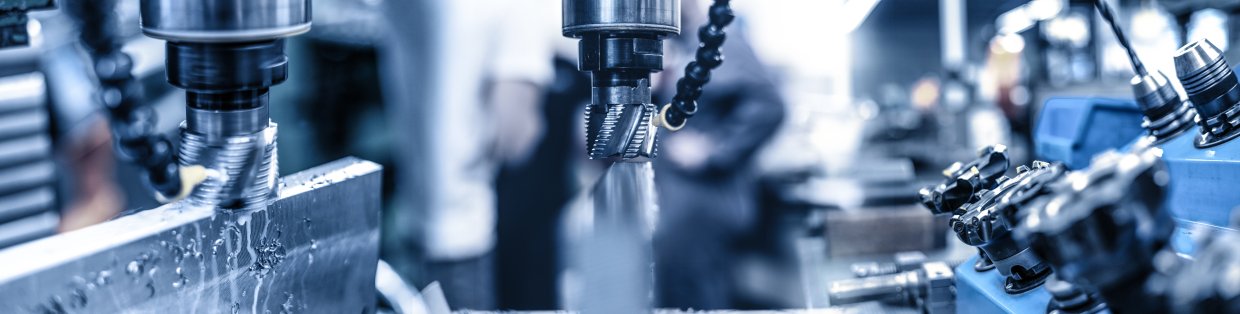 mechanical image of a drill being used with water spraying on the spot it's drilling into.