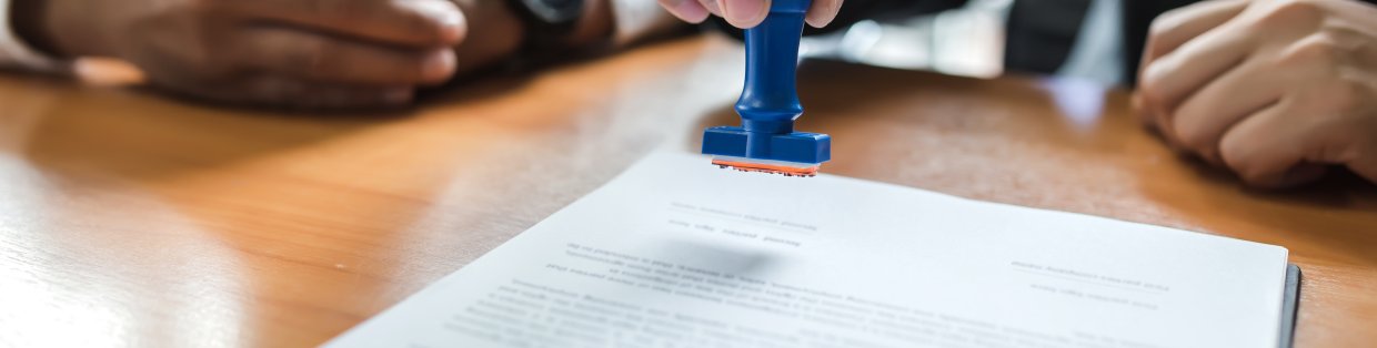 two people reviewing documents. 